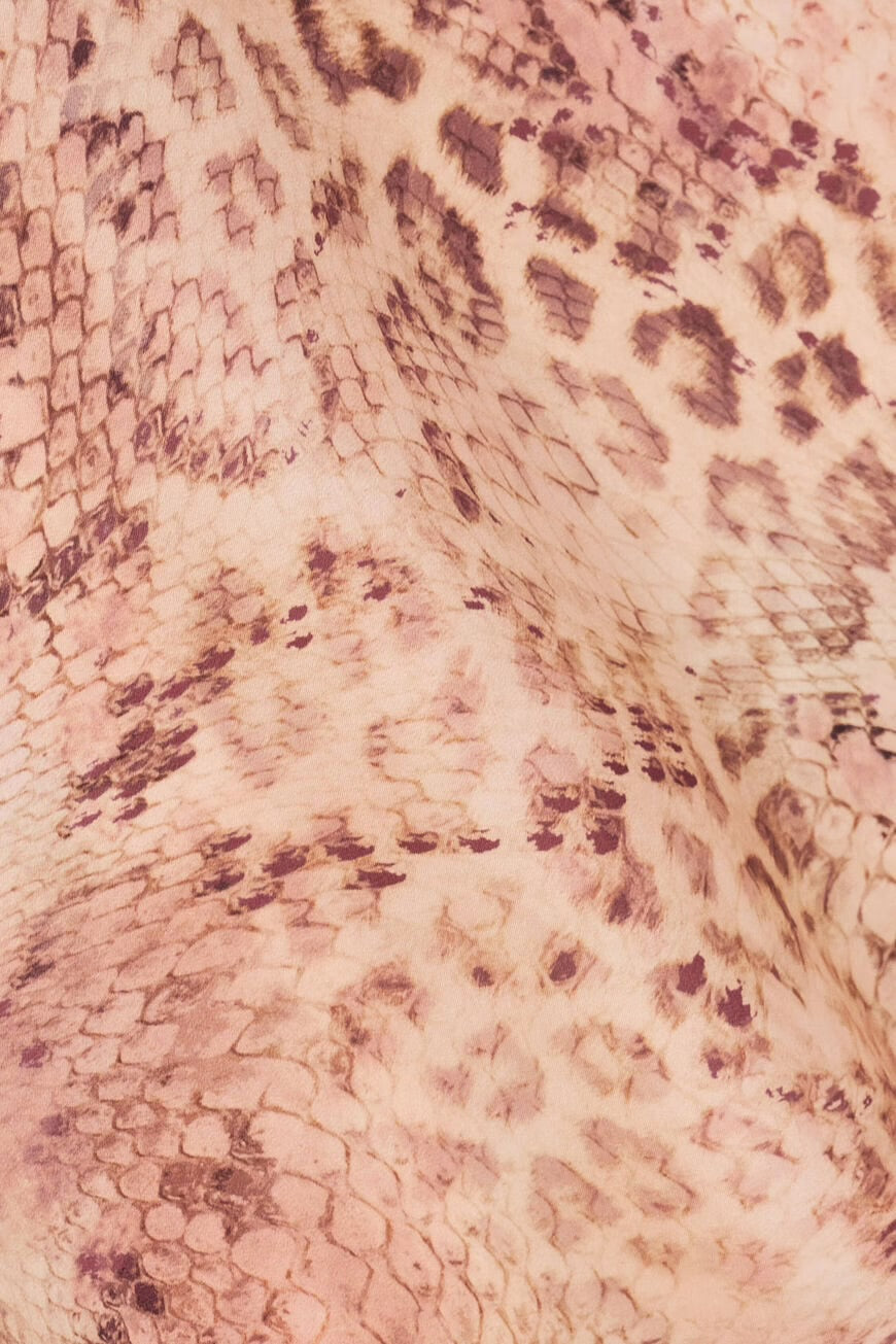 Close-up of a pink fabric with a subtle pattern.
