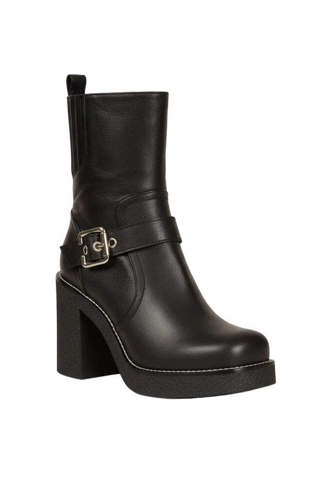 Black leather boot with a buckle on a white background.