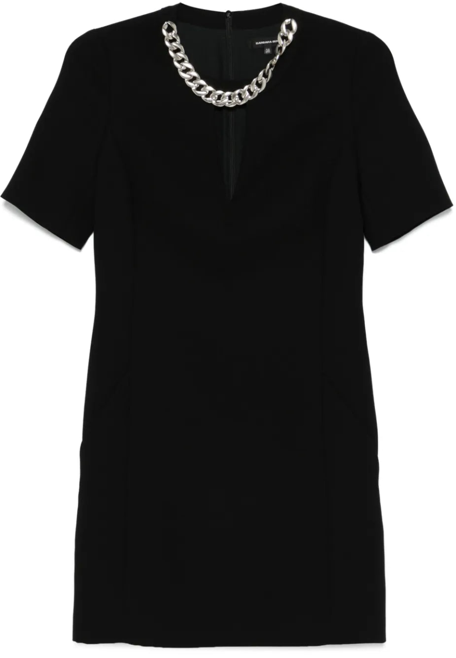 Black dress with a silver chain detail on a white background