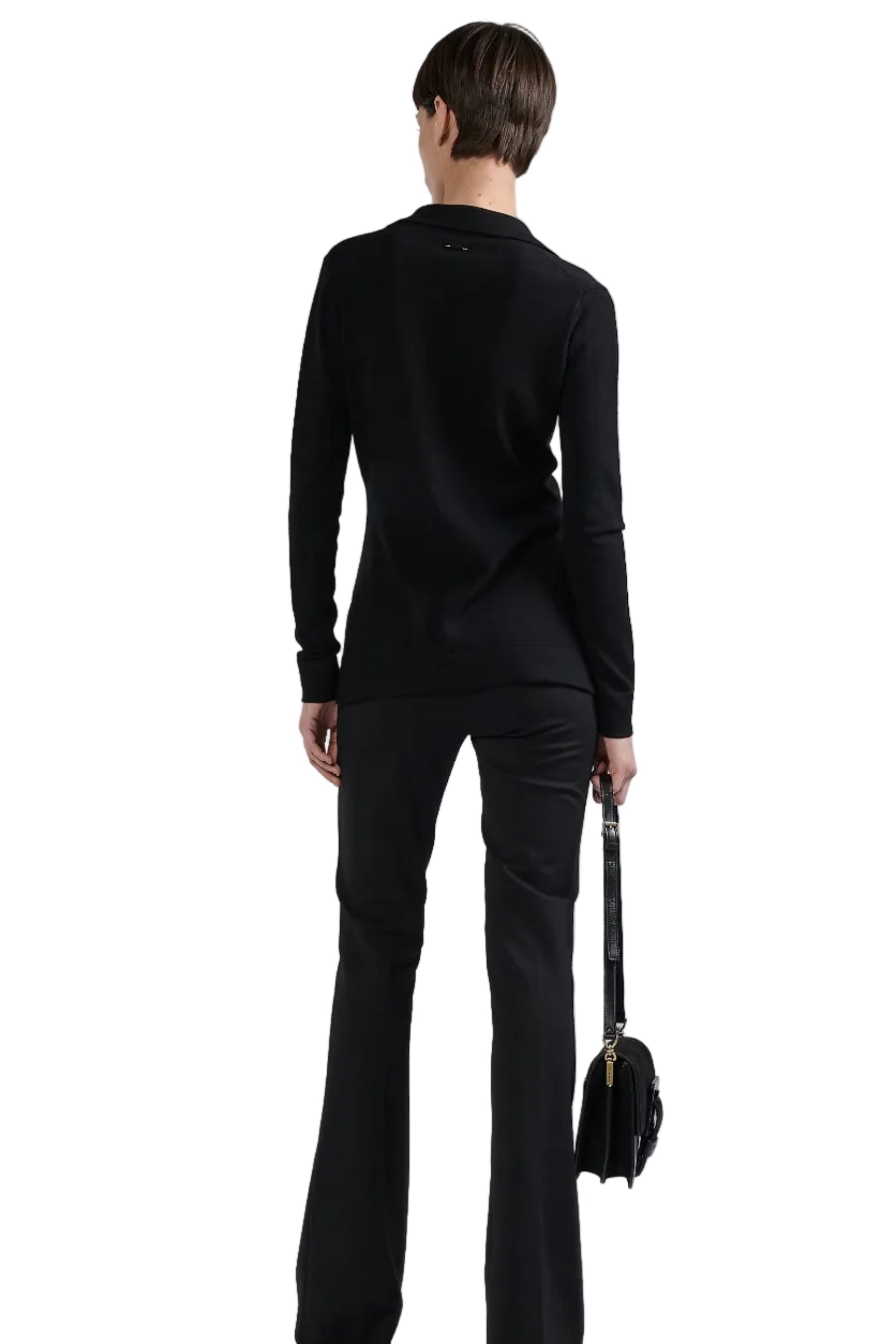 Person wearing a black outfit with a plain background