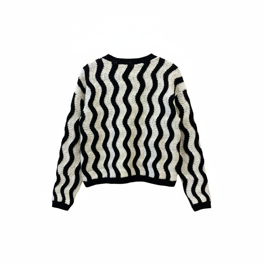 The back of a black and white striped sweater on a white background