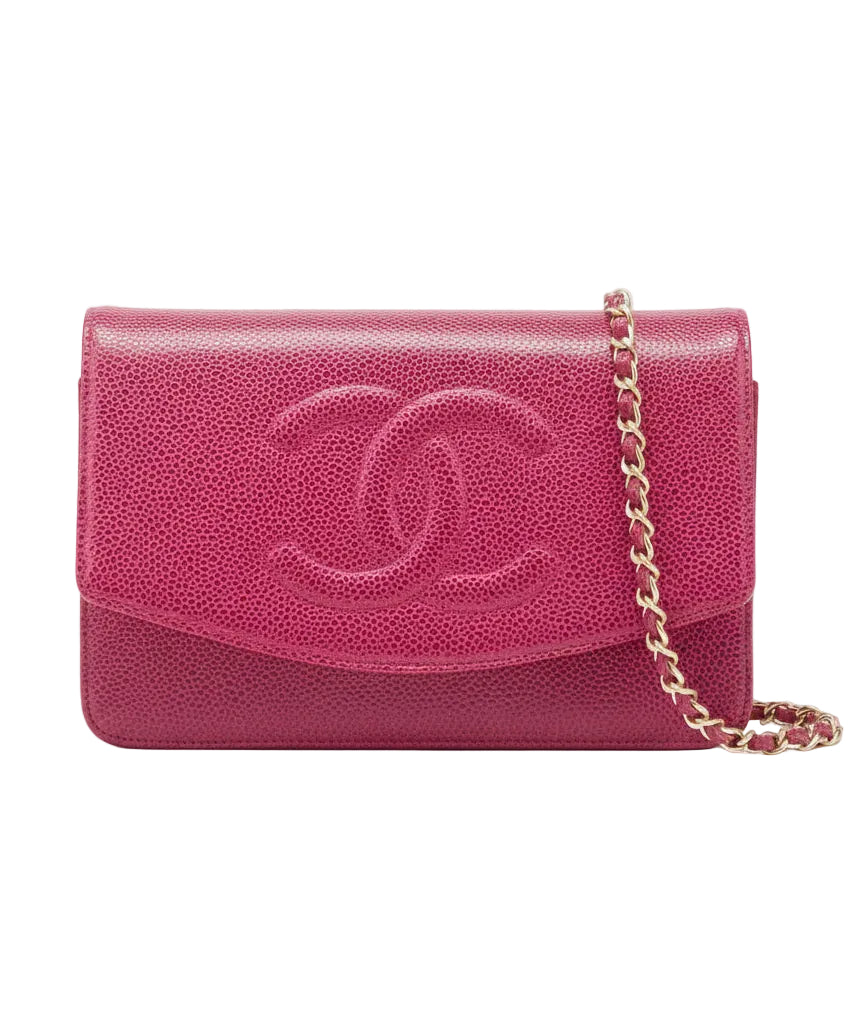 Pink handbag with gold chain on a white background.