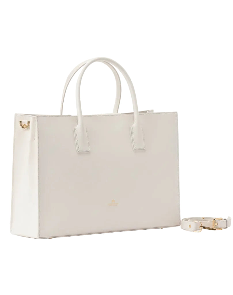 White handbag with a matching bracelet on a white background.