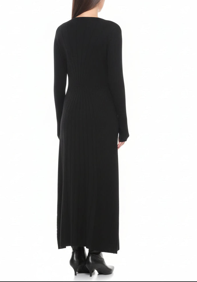 Black long-sleeve dress worn by a woman on a white background.