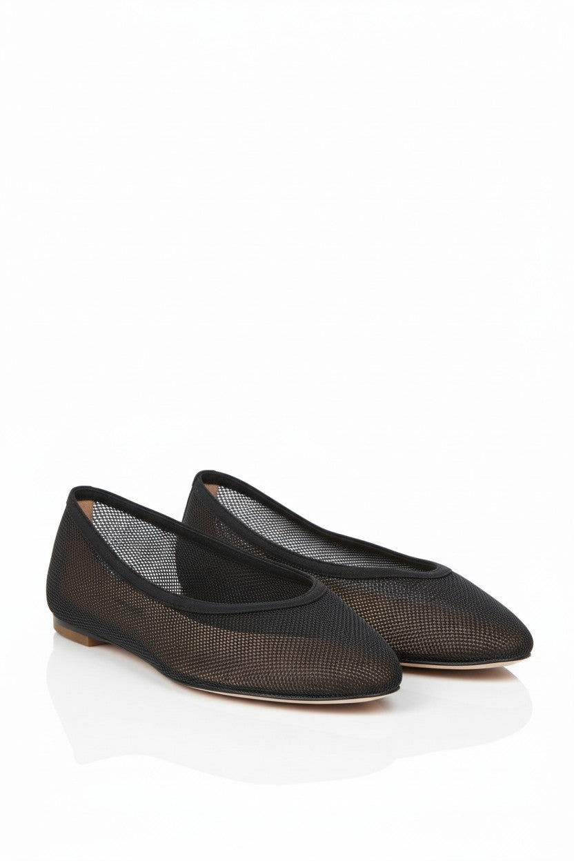 Black mesh flats on a white background.