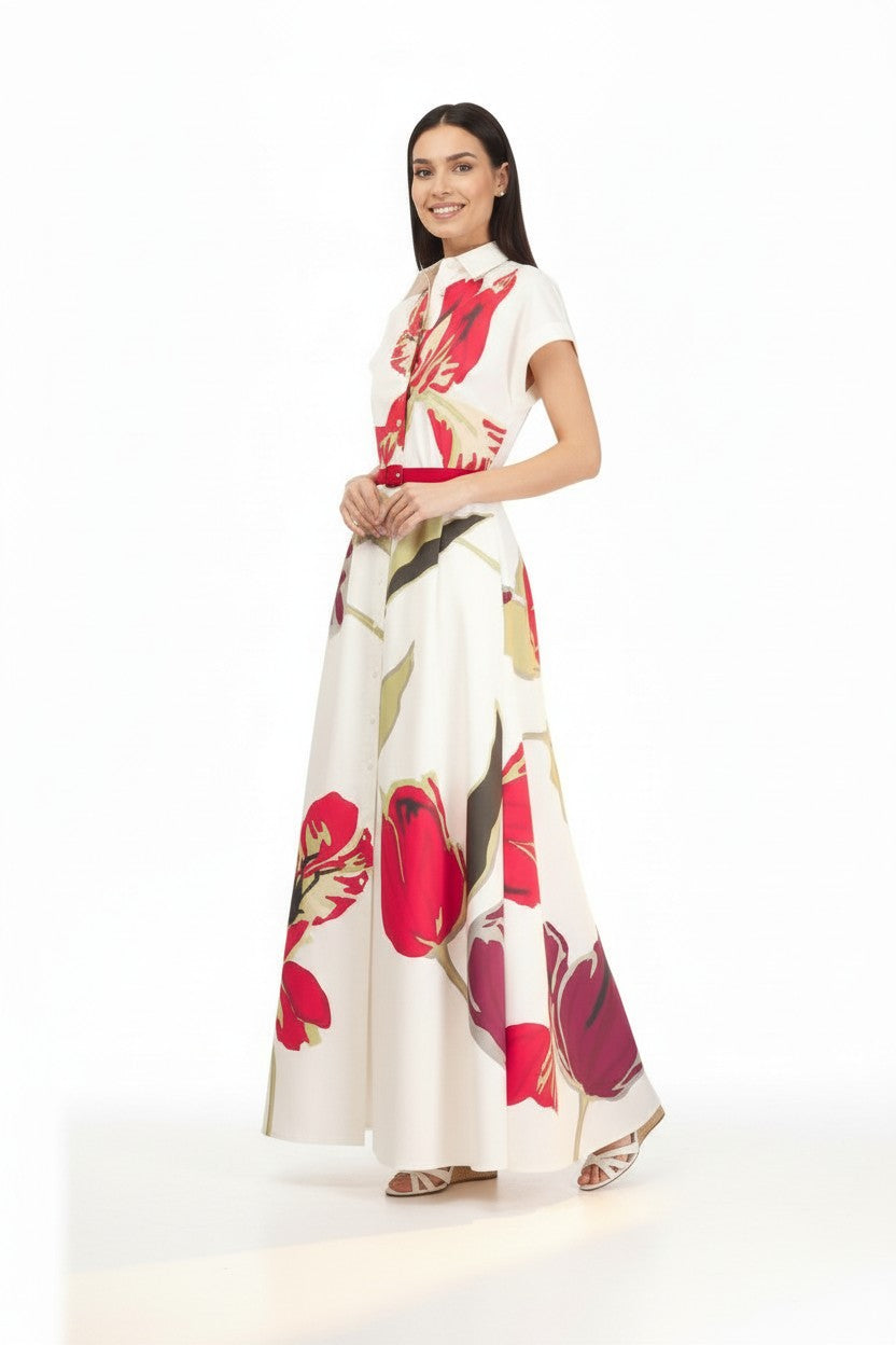 Woman wearing a white floral dress on a white background.