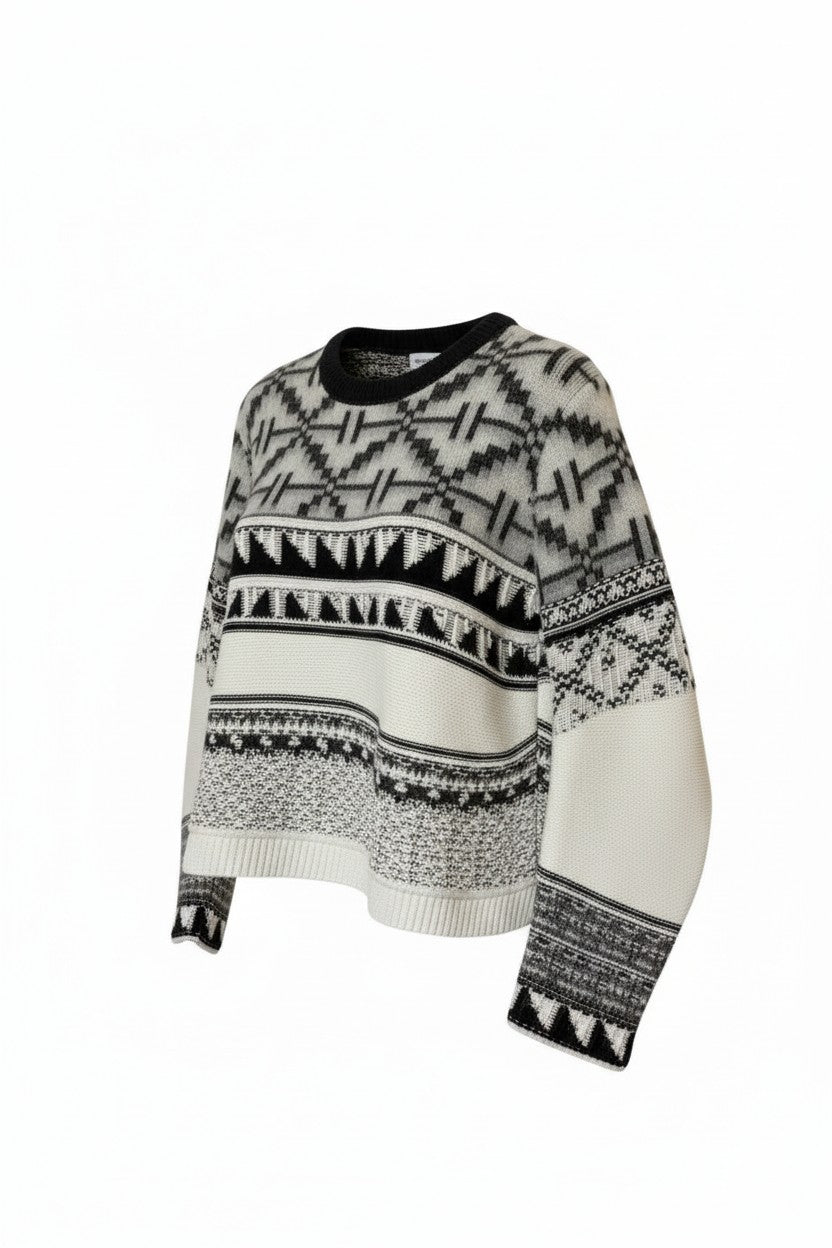Black and white patterned sweater on a white background
