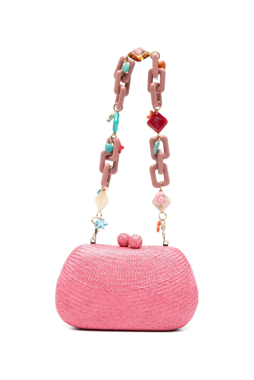 Pink handbag with a decorative chain on a white background.