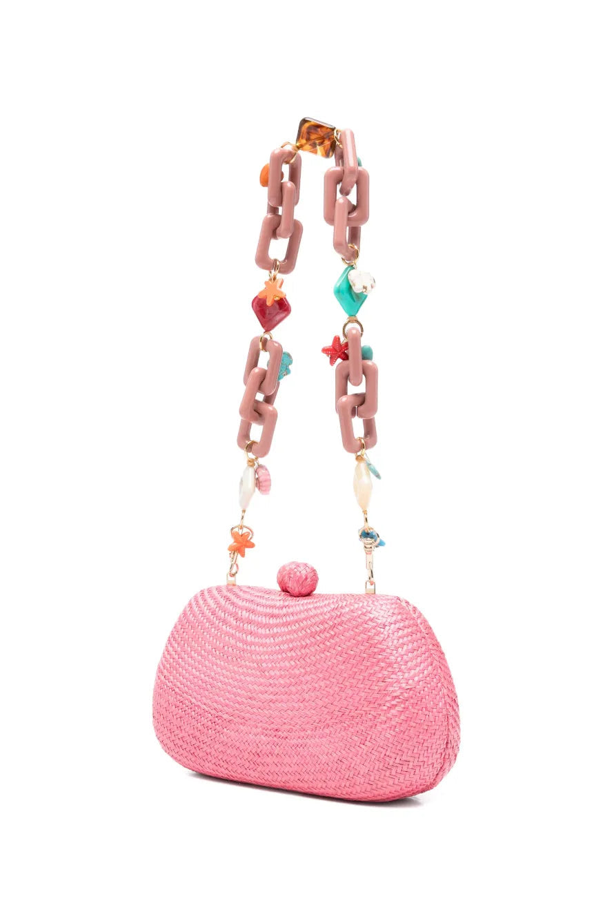 Pink handbag with a colorful chain strap on a white background.