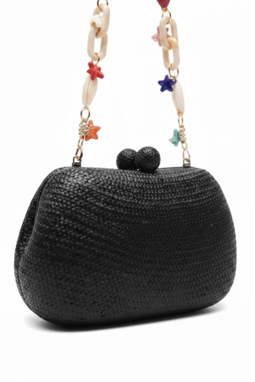 Close-up of the Heidi Bun Bag by Serpui on a white background.