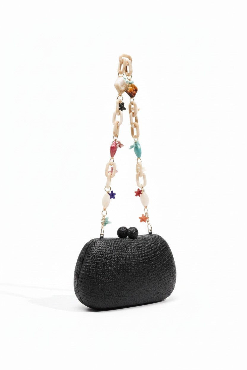 Serpui black Heidi Bun Bag on a white background.