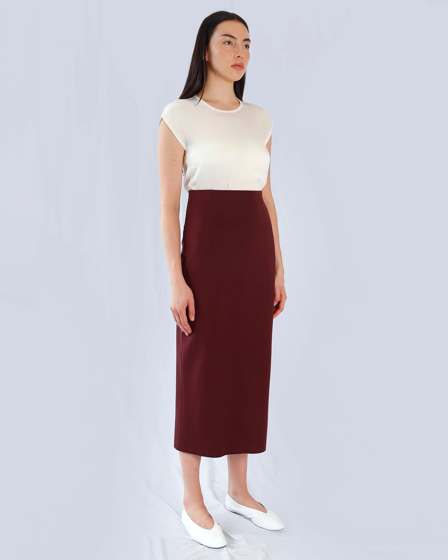 Marie Saint Pierre Tarselle burgundy high-waisted midi skirt, three-quarter model view