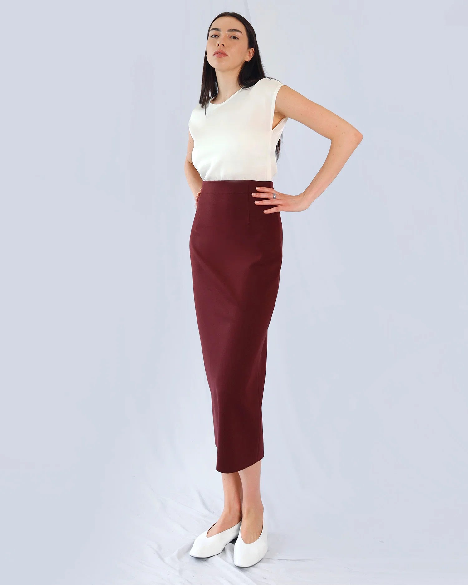 Marie Saint Pierre Tarselle burgundy high-waisted midi skirt, angled front model view