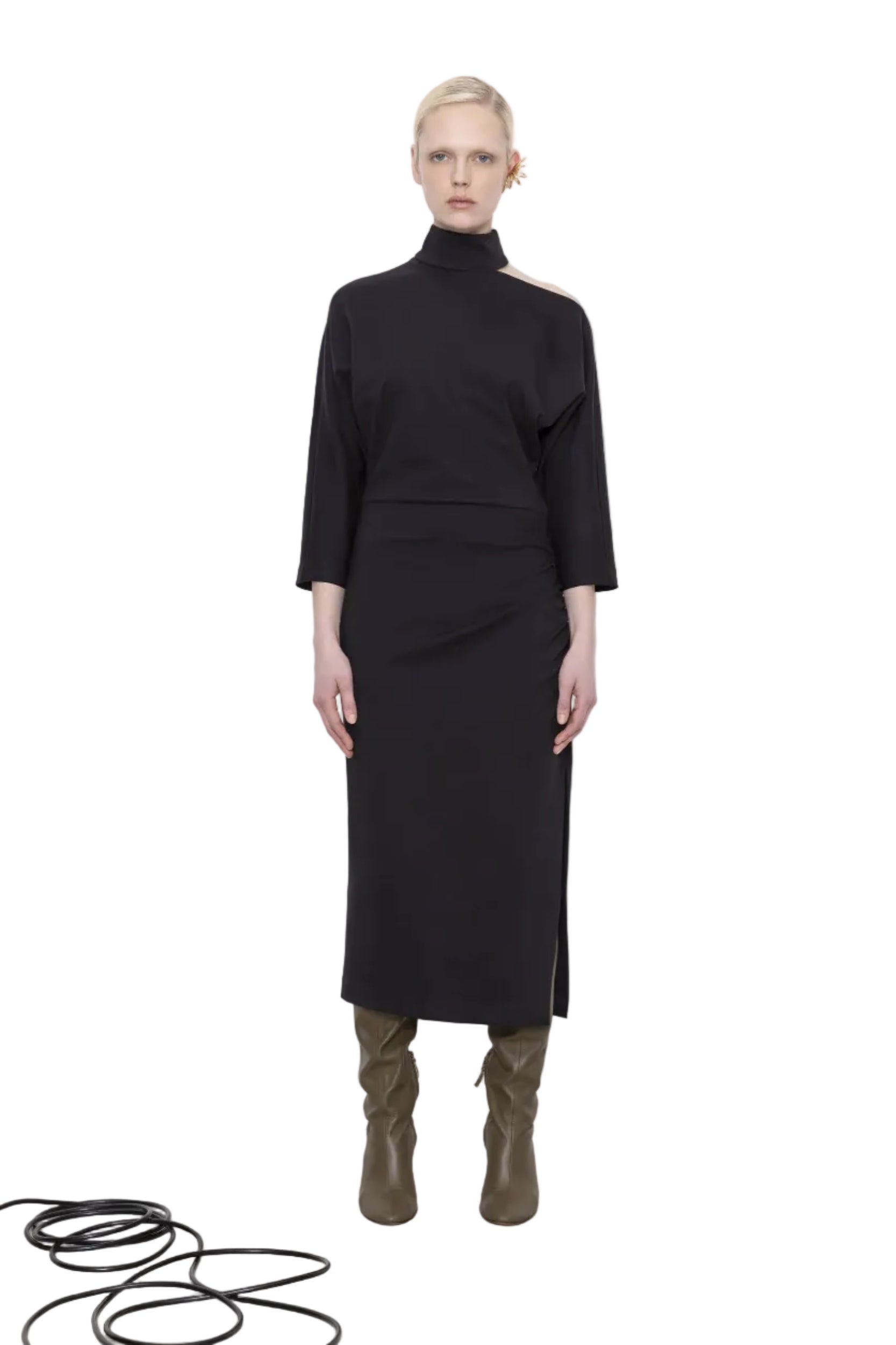 Woman wearing a black dress with a white background.