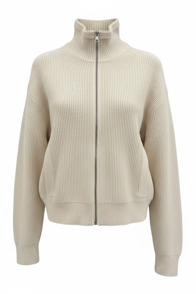 Beige ribbed knit zip-up sweater on a white background.