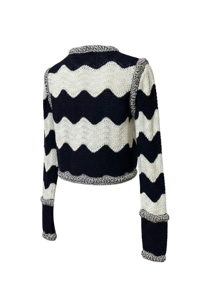 Back of a navy and white sweater with textured trim on a white background.