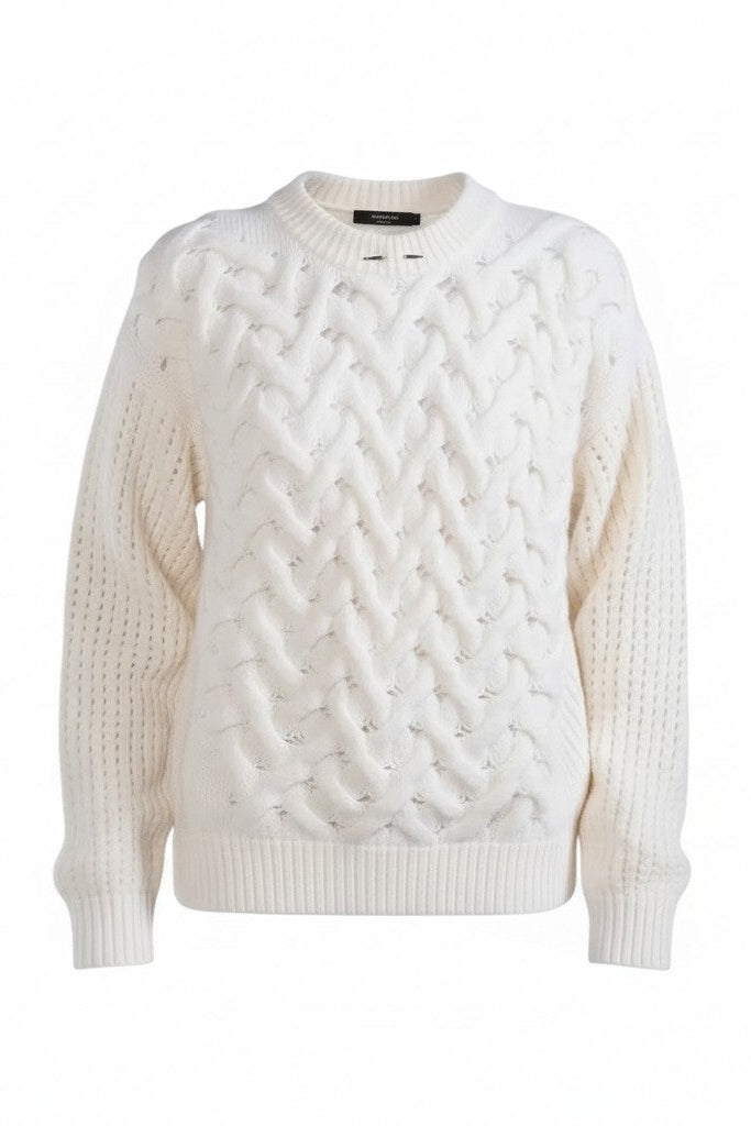 White cable knit sweater on a white background.