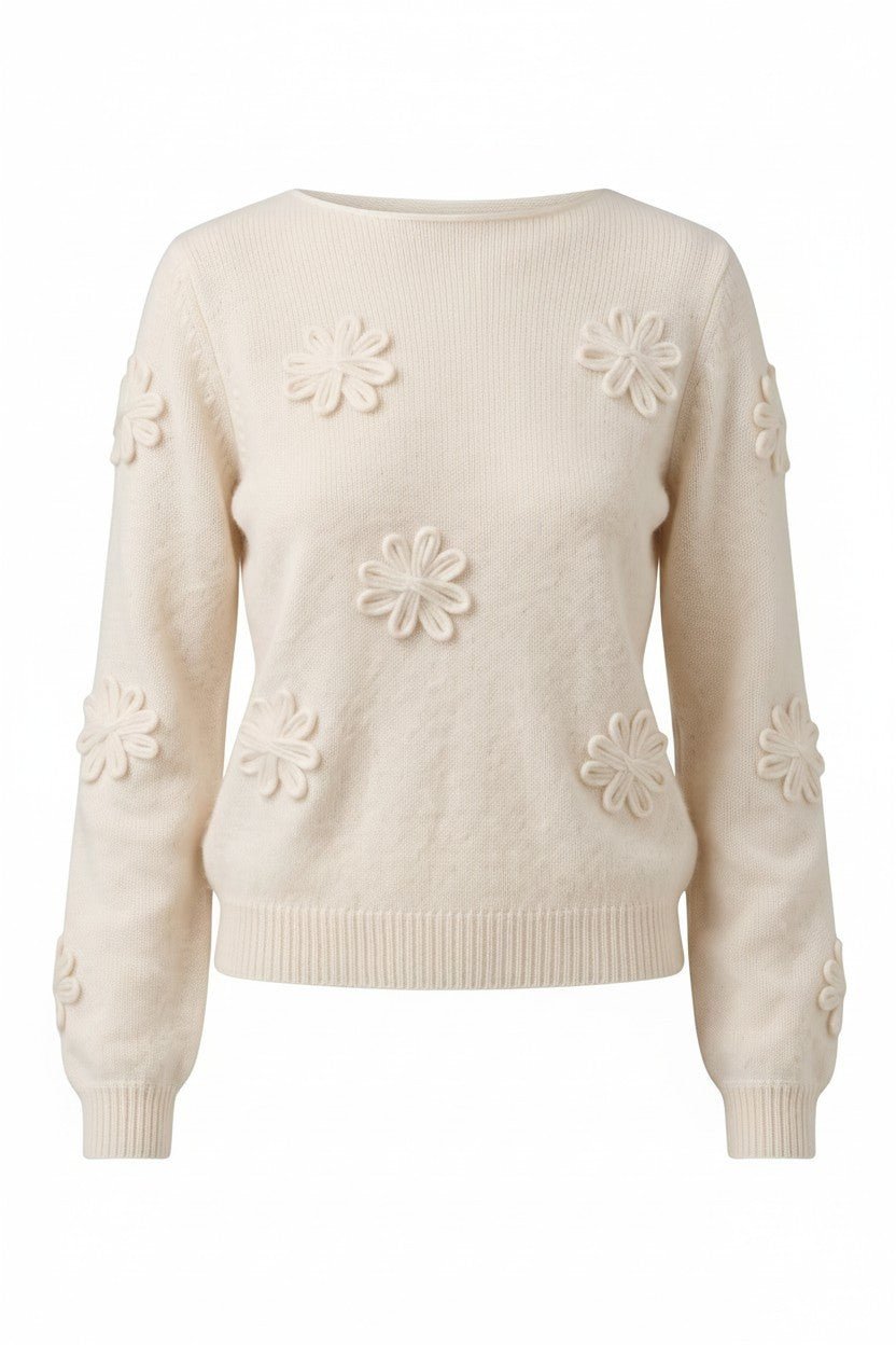 An off-white cream knit sweater with raised 3D daisy flower motifs on the front and sleeves, shown against a plain white background.