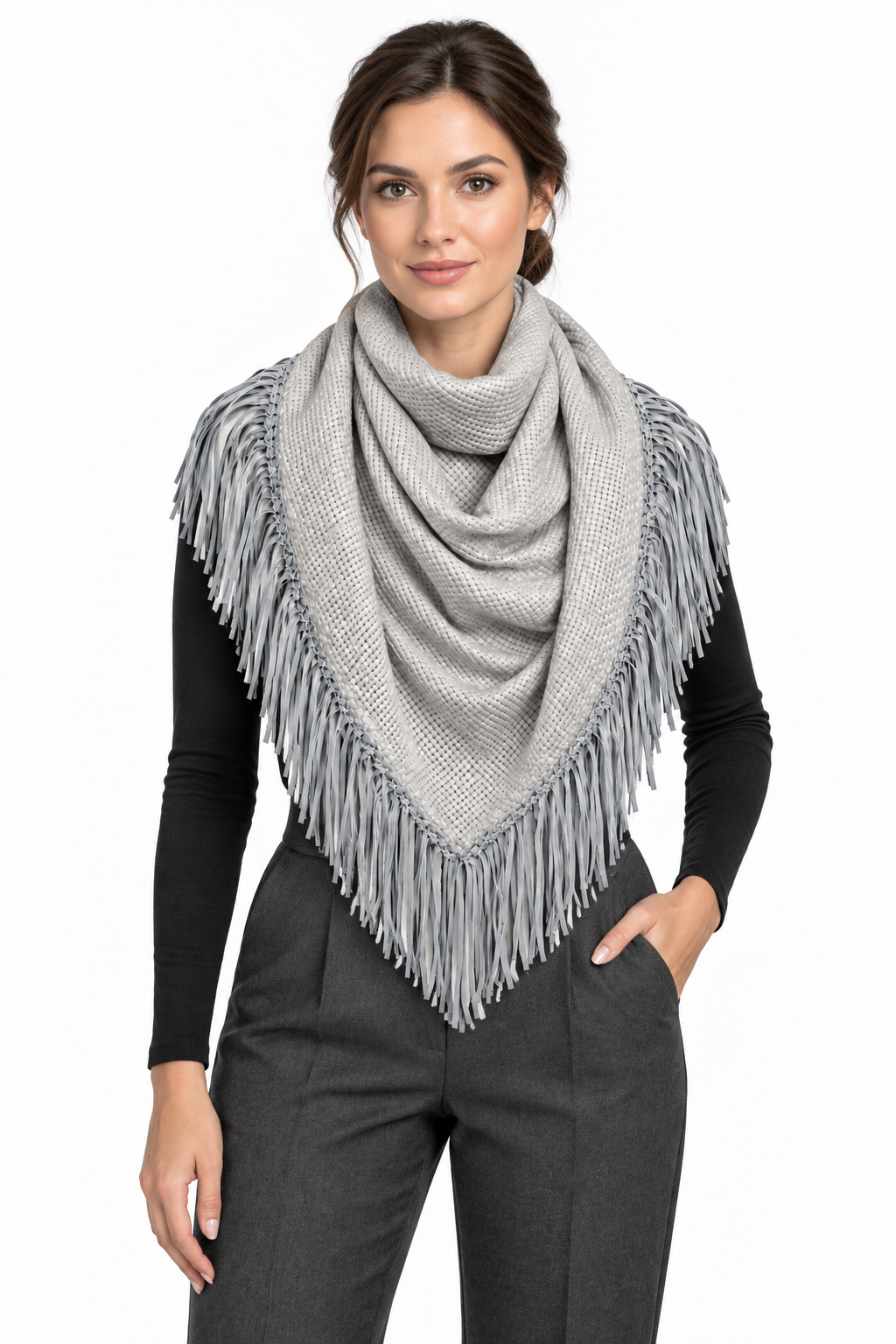 Front-facing model wearing a light-gray triangular Bajra scarf with matching braided trim and long fringe over a black top and charcoal trousers.
