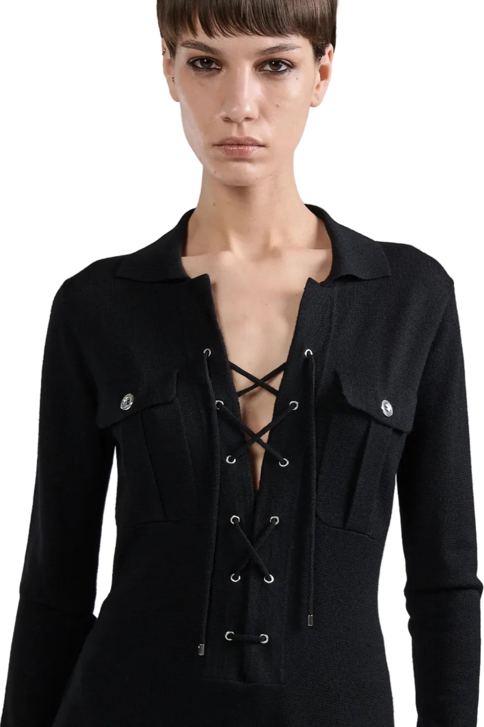 Black outfit with lace-up front on a plain background