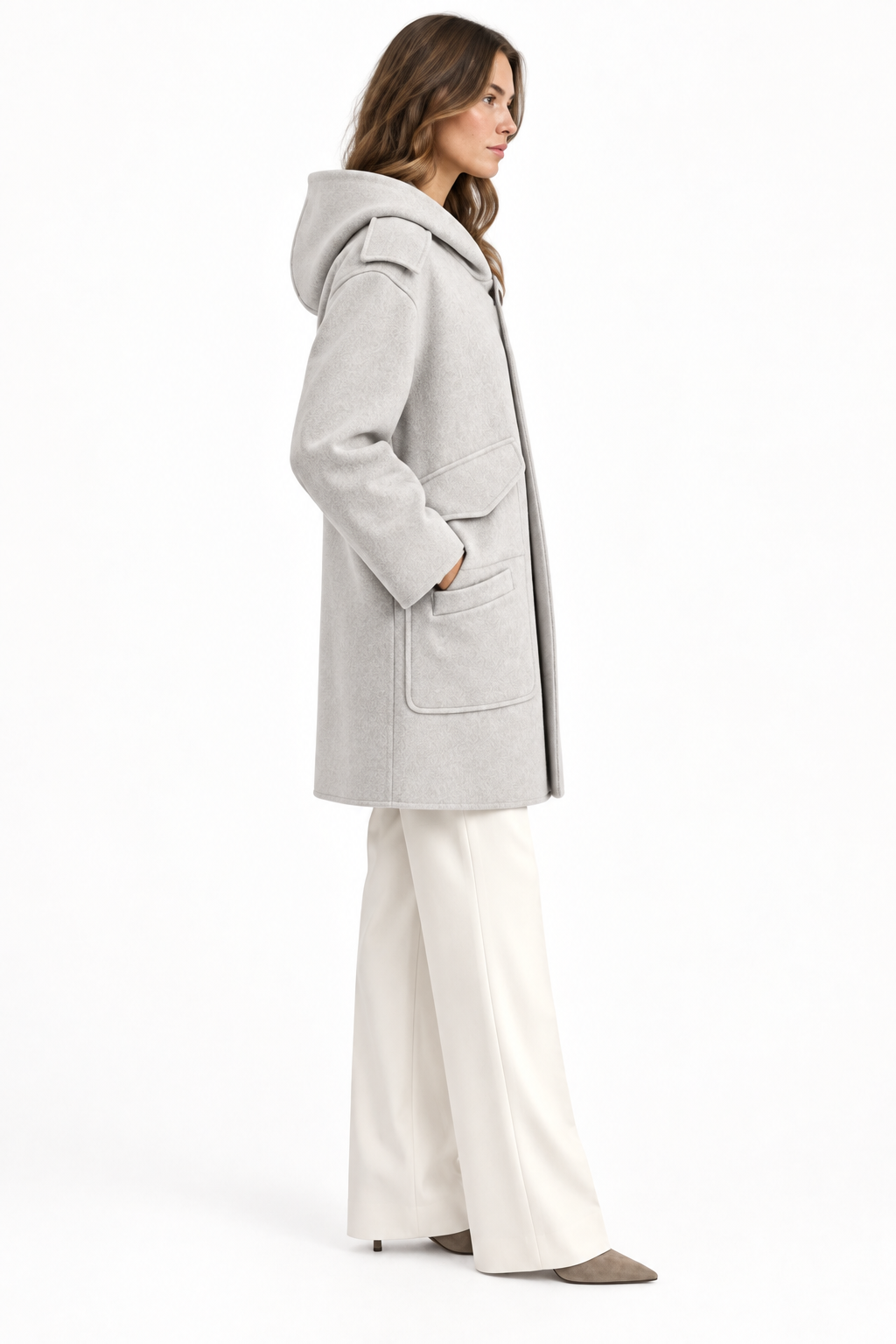 Model wearing a light gray Barbara Bui hooded wool and cashmere coat with oversized pockets, side view.