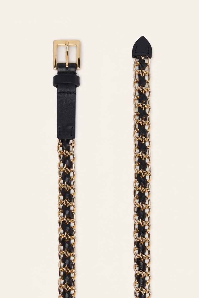 A black leather belt with a gold-tone chain link pattern and a gold buckle, shown on a light beige background.