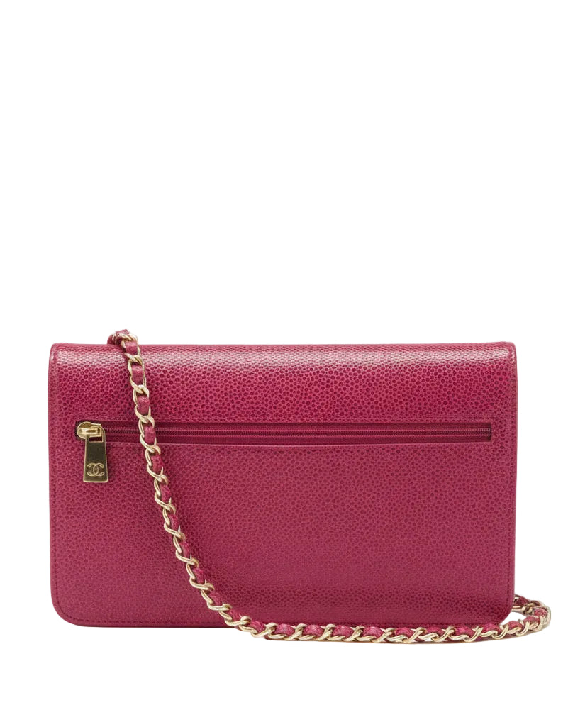 Pink handbag with a gold chain on a white background.