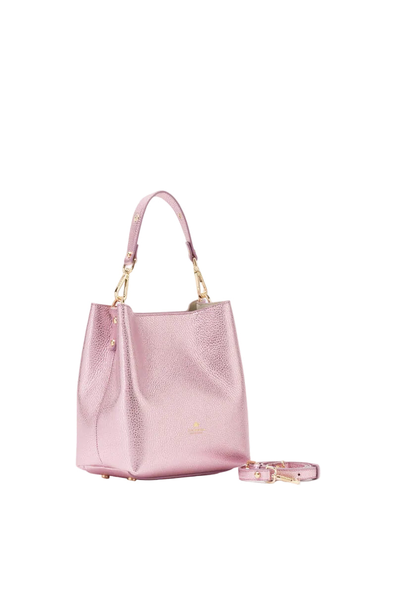 Pink handbag with matching bracelet on a white background.