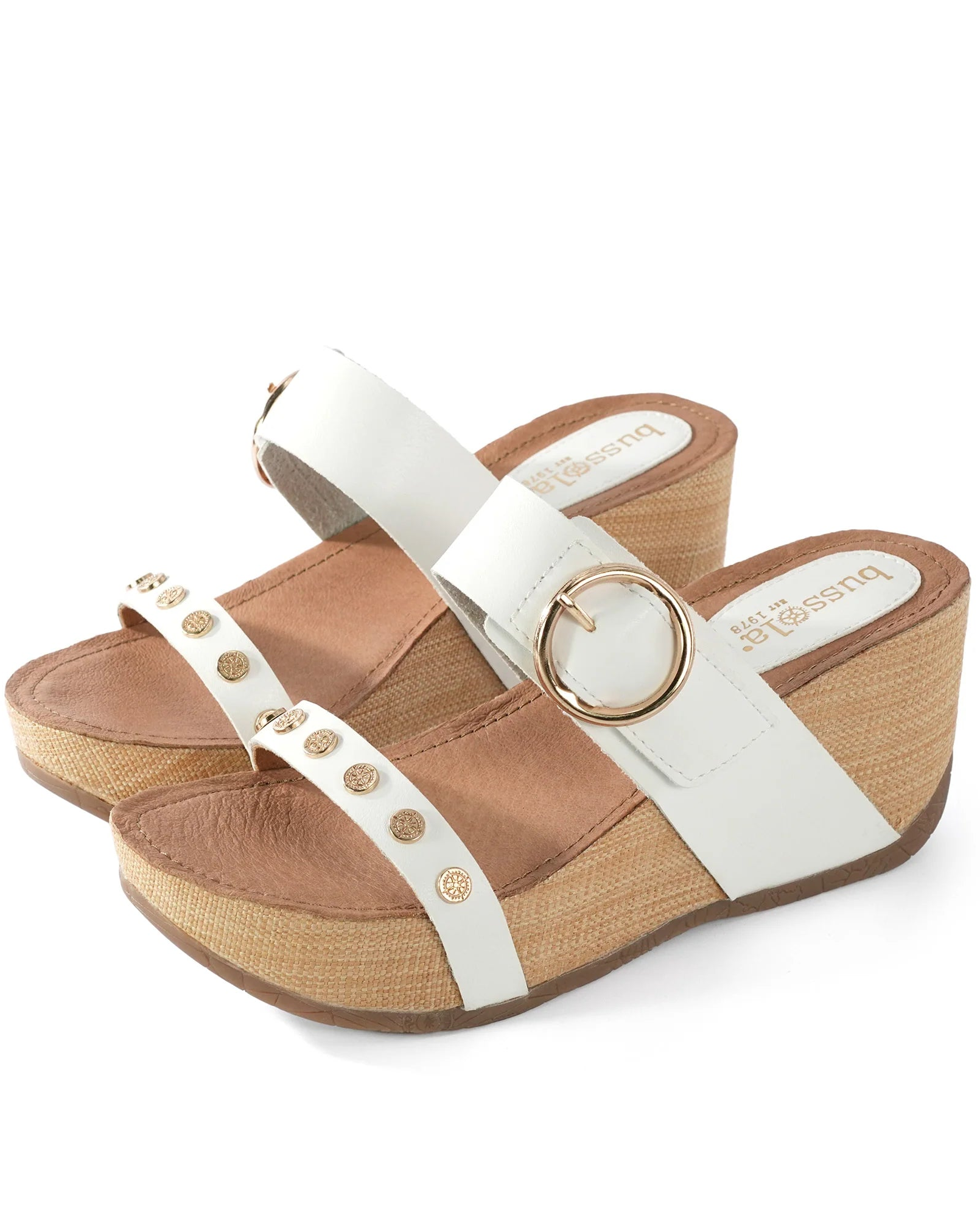 Wedge sandal with white strap and brown wedge on a white background.