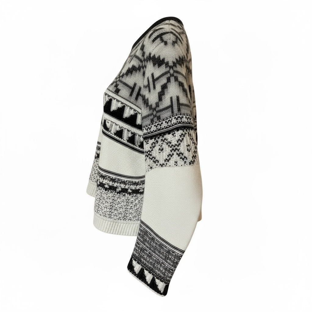 Side view of sweater with black and white pattern on a white background.