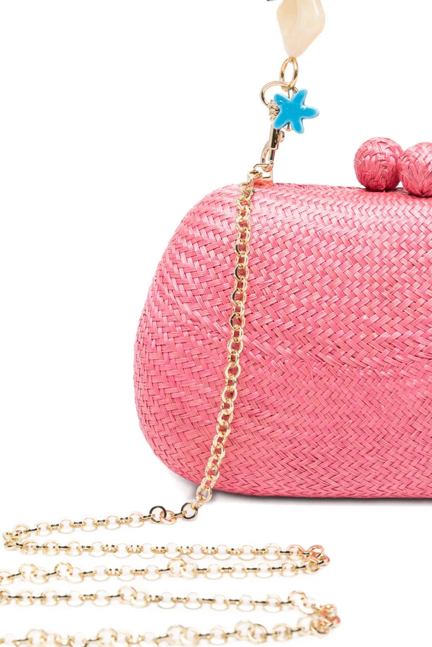 Pink woven handbag with a gold chain strap on a white background.