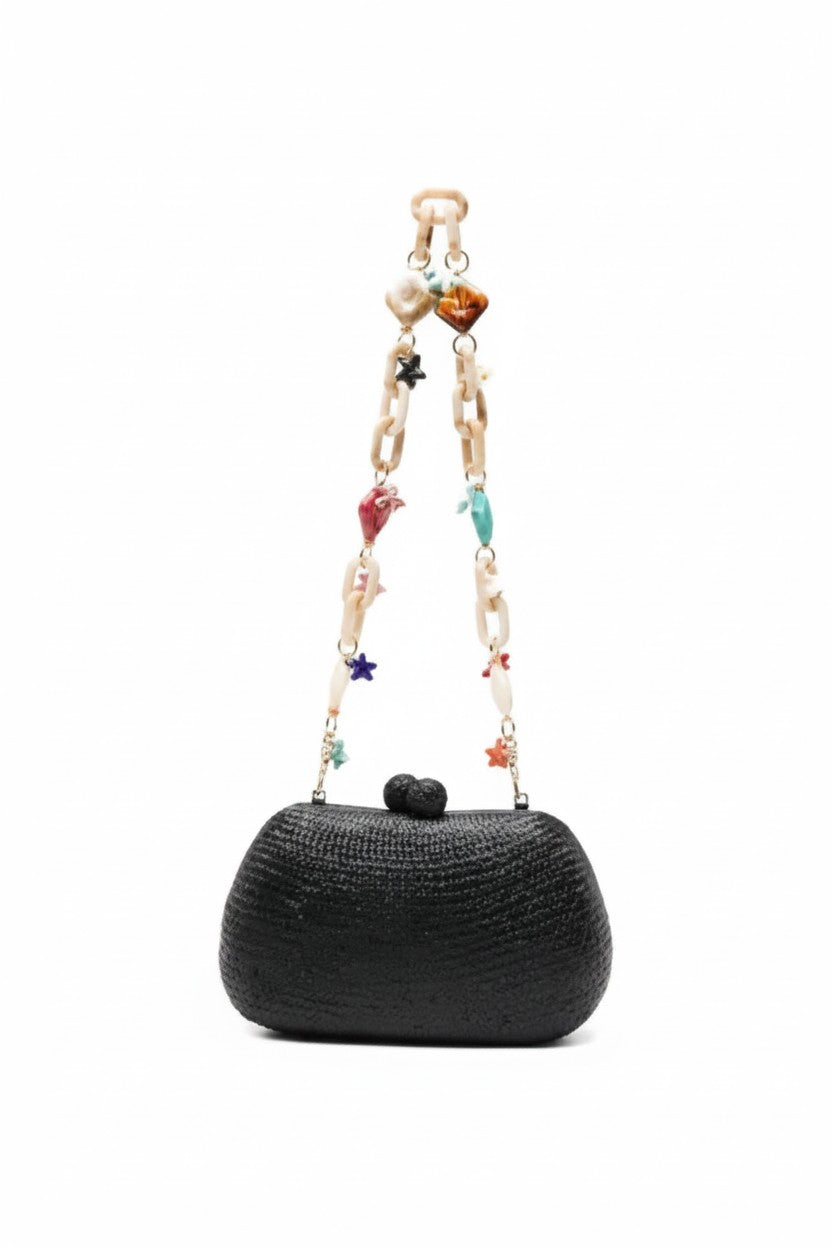 Black handbag with a colorful beaded strap on a white background.