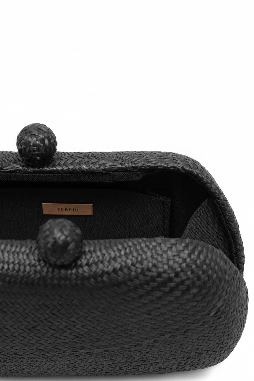 Close-up of the black Heidi Bun Bag by Seroui on a white background.