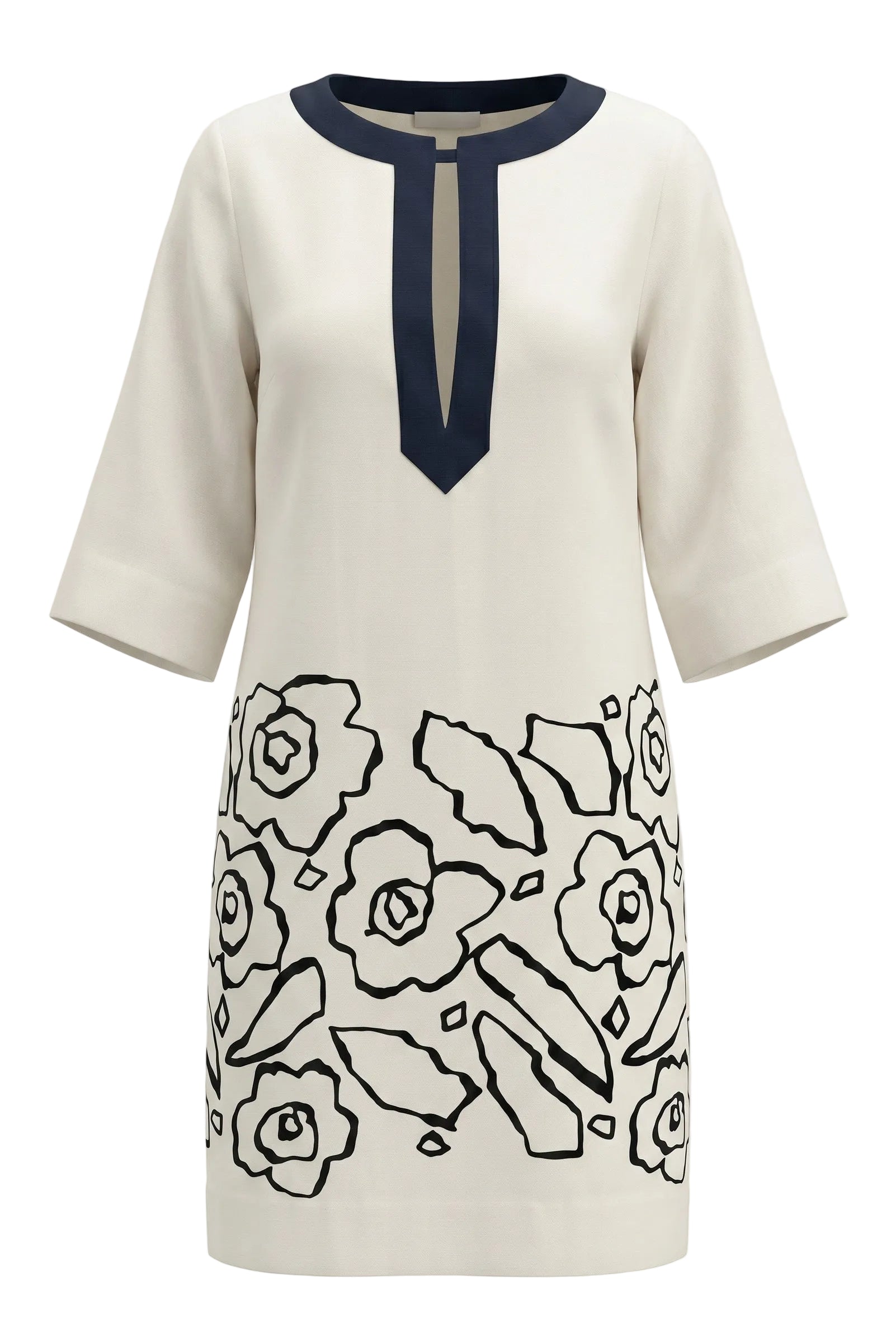 White dress with navby floral pattern and navy neckline on a white background.