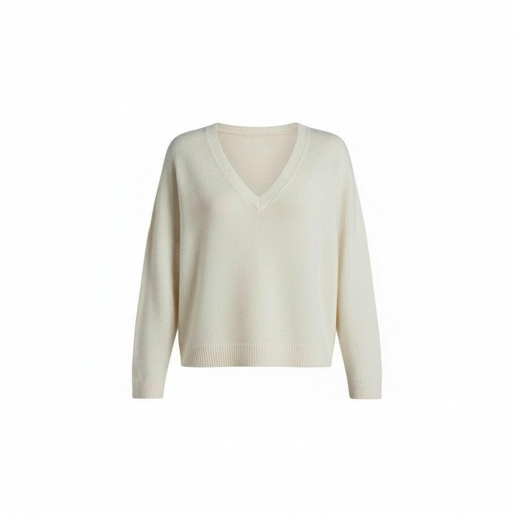 Off white sweater on a white background.