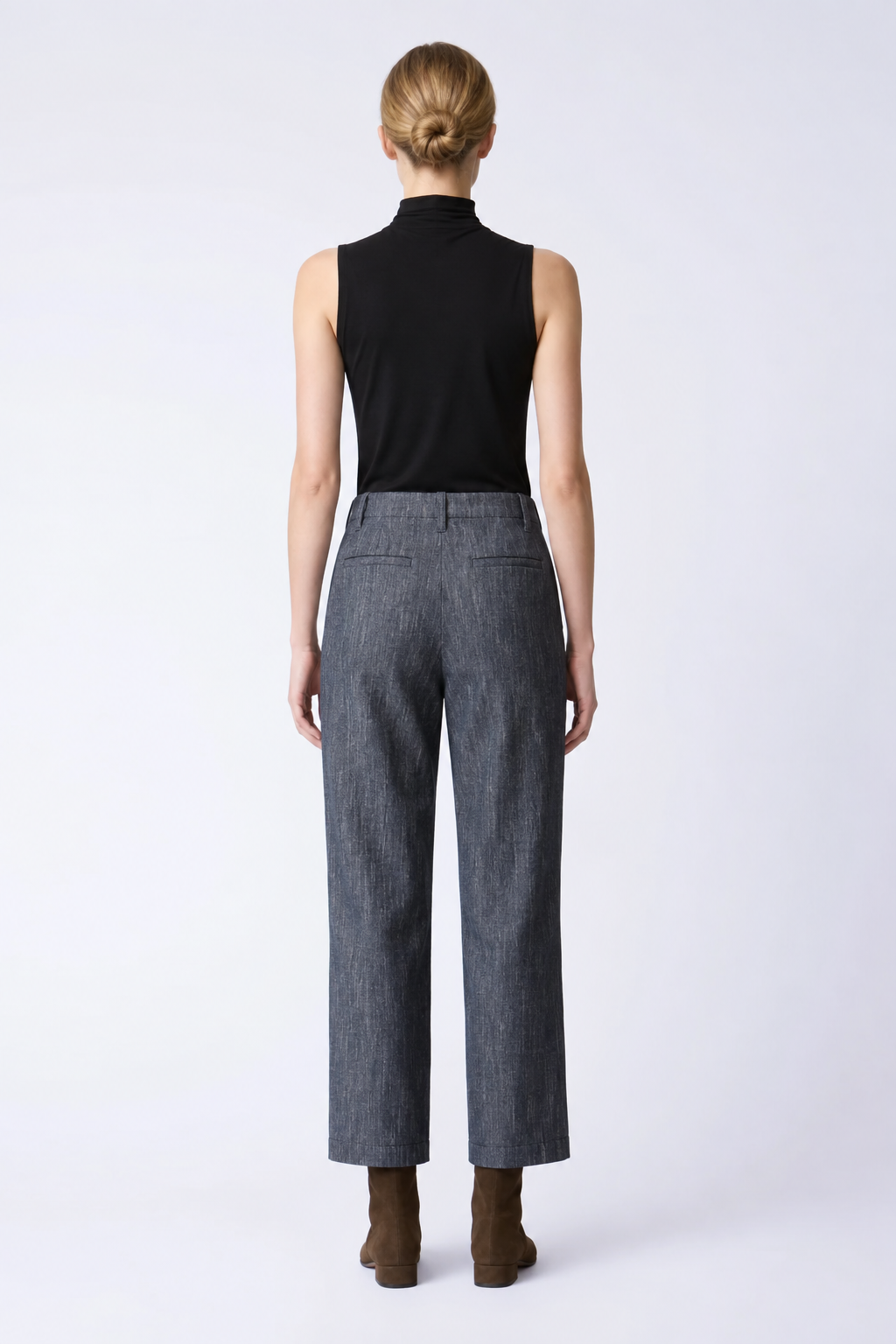 Back view of the Kal Rieman Joni Pant featuring belt loops, back besom pockets and topstitched hems.