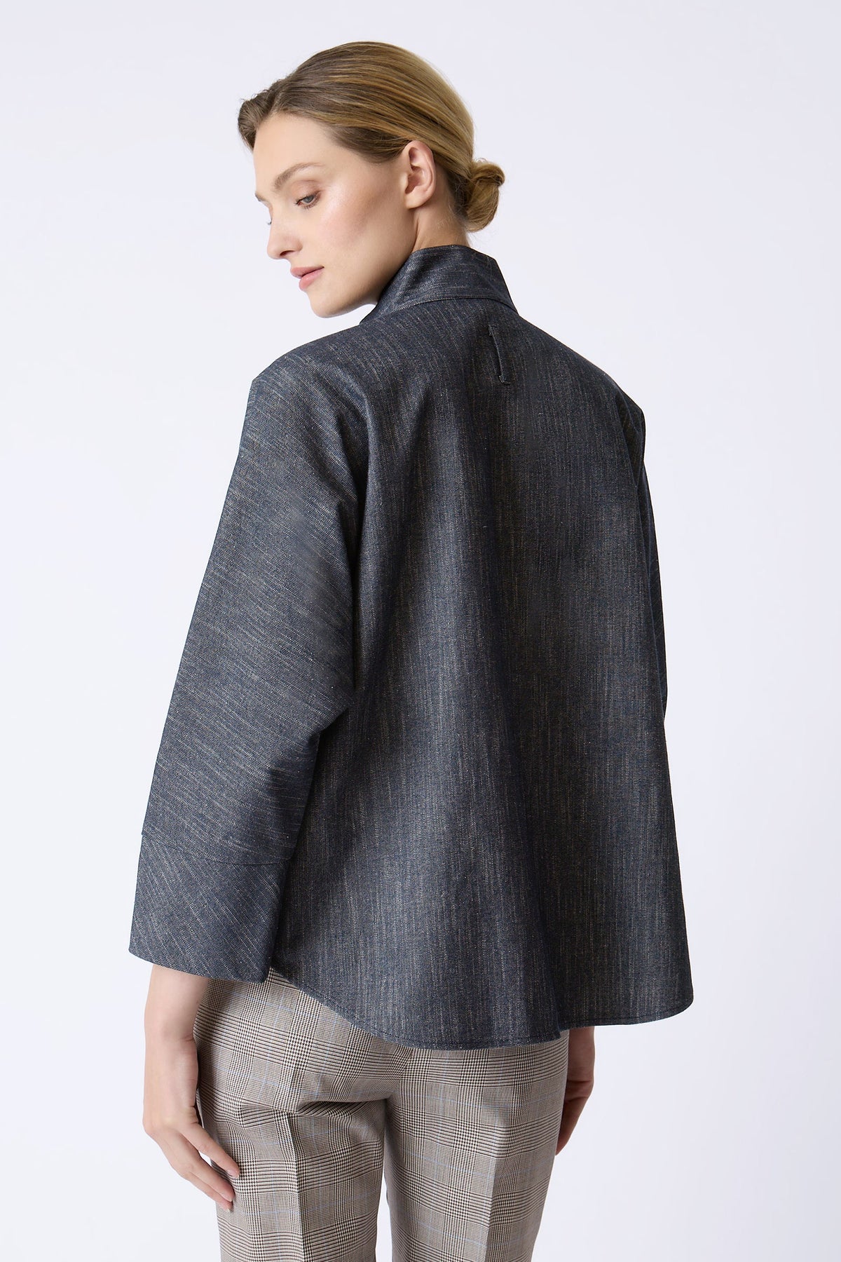 Back view of the oversized Kal Rieman Maves Shirt in textured indigo denim.