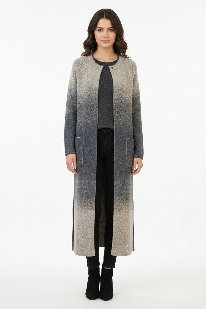 Woman wearing a long, gradient coat on a white background.