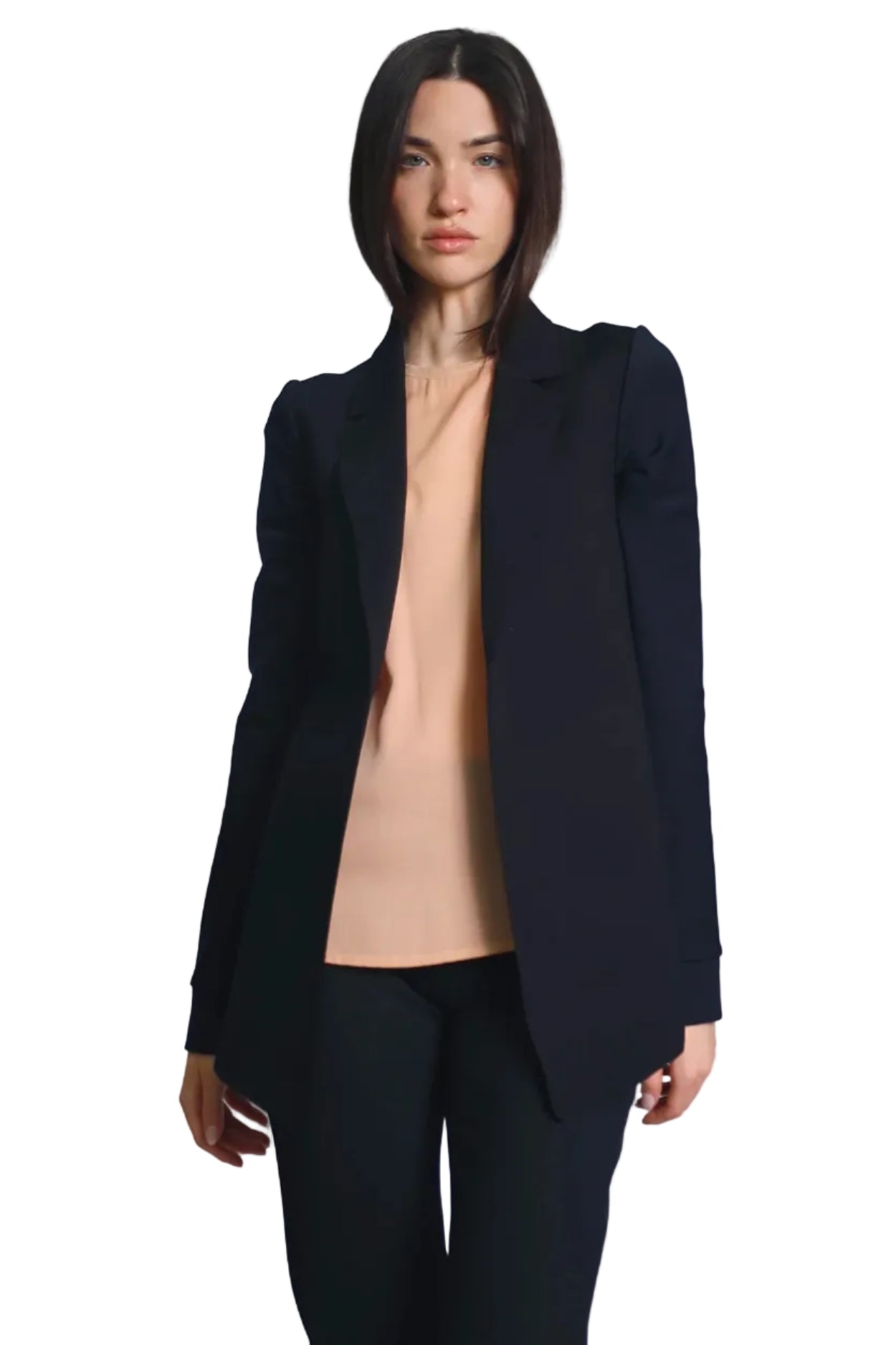 Woman wearing a black blazer over a beige top on a white background.