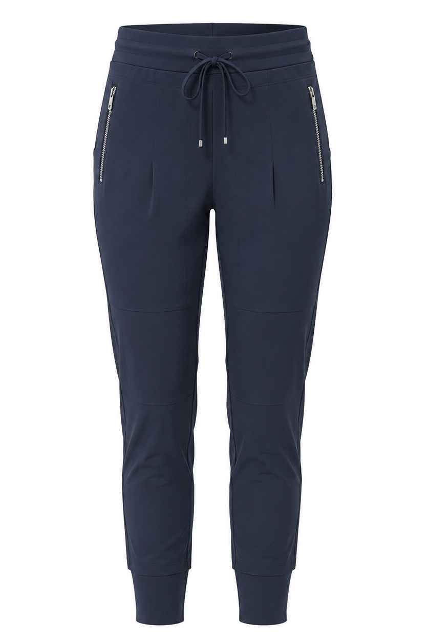 A pair of navy blue jogger-style pants with a drawstring waist, zippered side pockets, and ribbed ankle cuffs, shown against a plain white background.