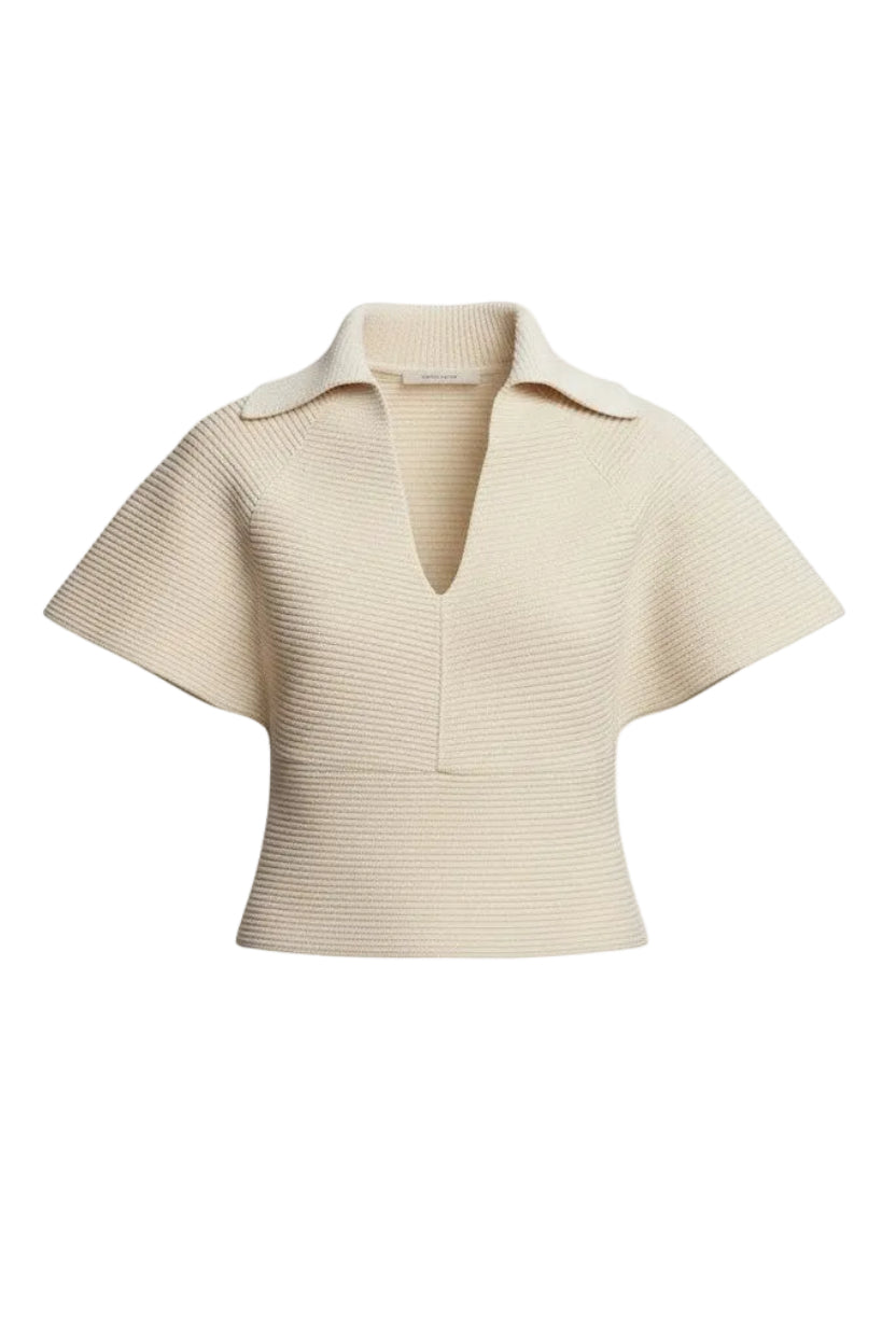 Beige knit top on a white background.
