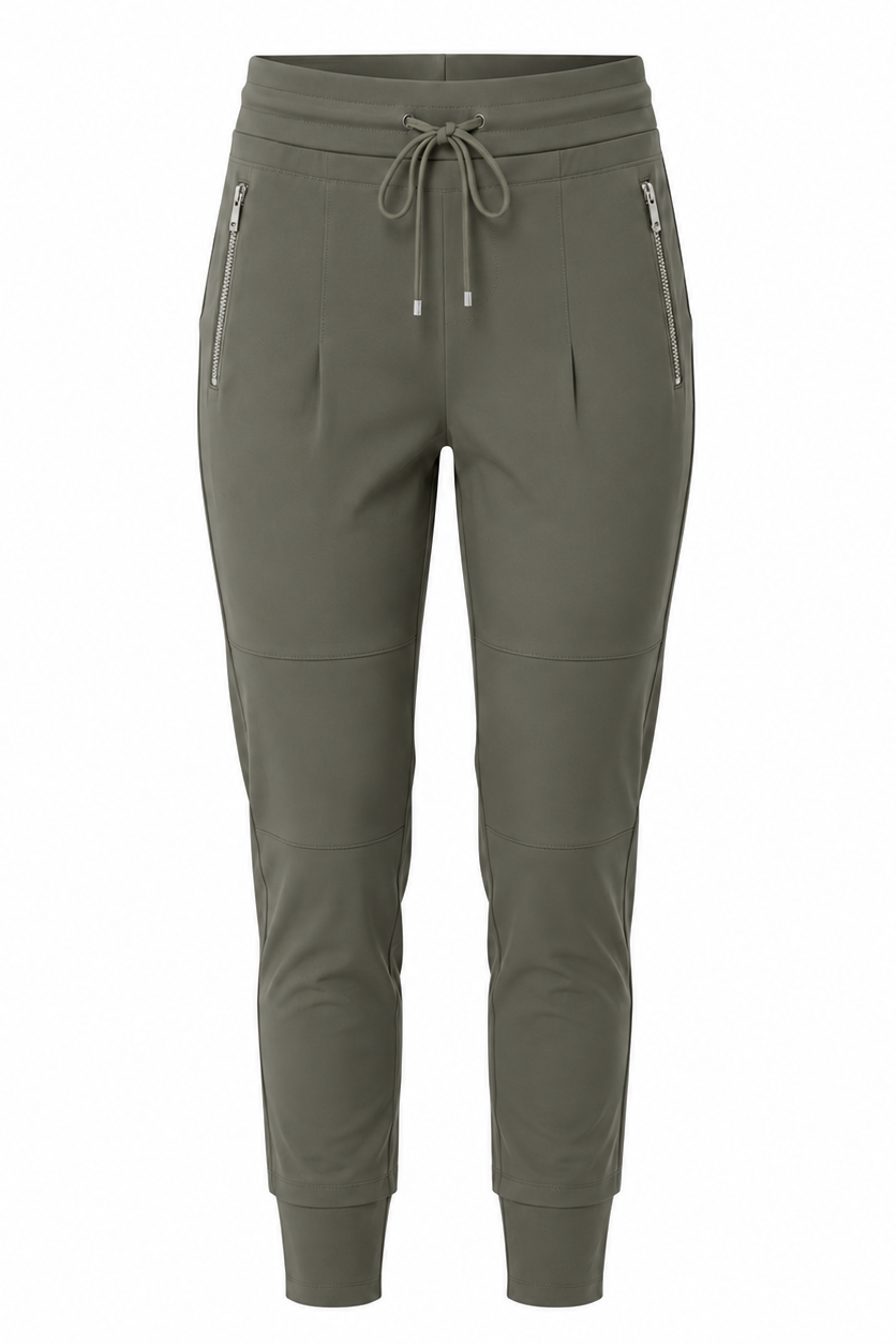 A pair of women's jogger-style pants in olive green, featuring an elastic waistband with a drawstring, zippered side pockets, and ribbed ankle cuffs, shown against a plain white background.