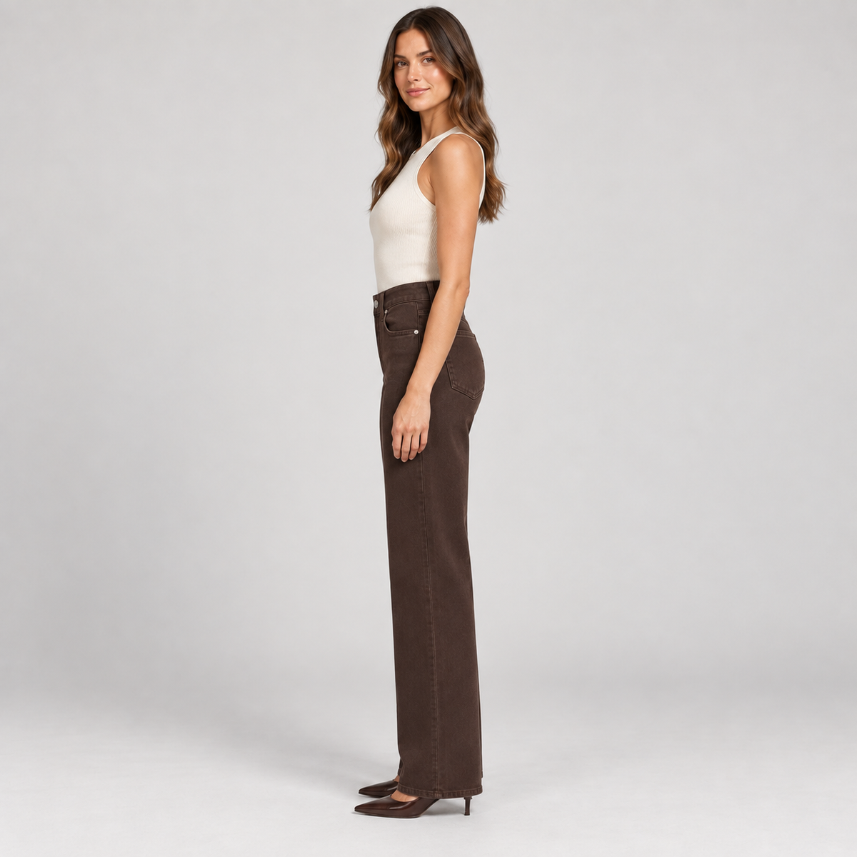 Side view of PAIGE Anessa rich chocolate-brown jeans showing the high-rise waist and straight wide-leg fit.