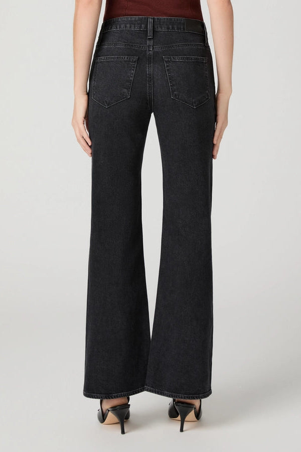 Back view of PAIGE Sofia black flare jeans showing the waistband, yoke, and two patch pockets.