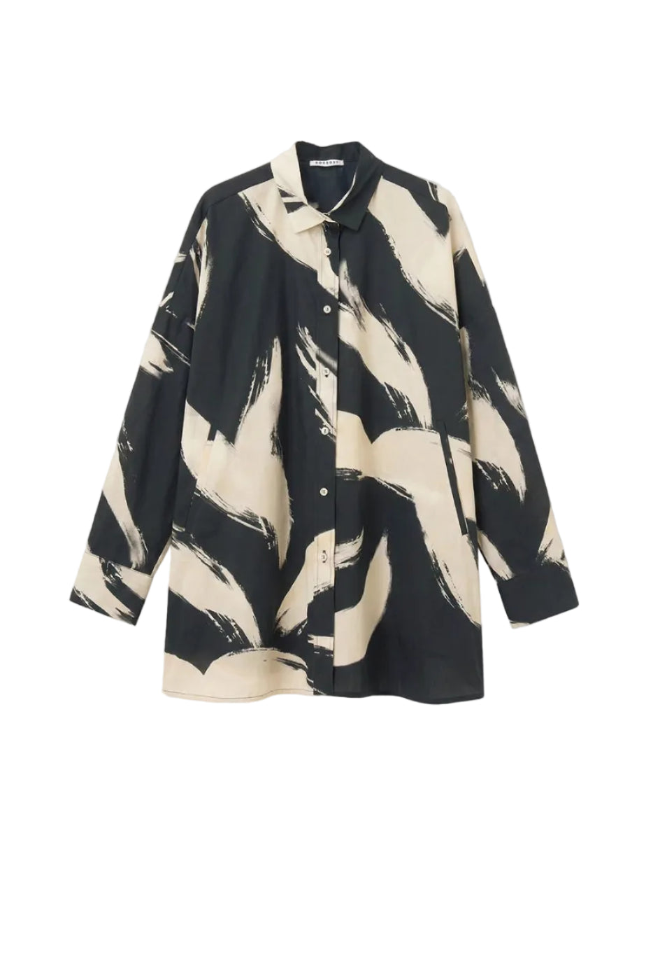 Black shirt with off-white abstract pattern on a whgite background.