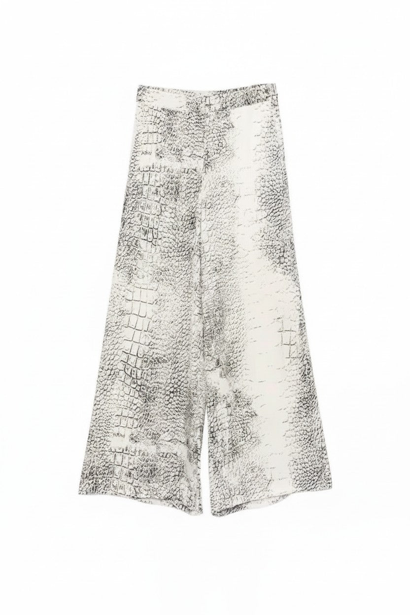 Wide-leg pants with a textured pattern on a white background.