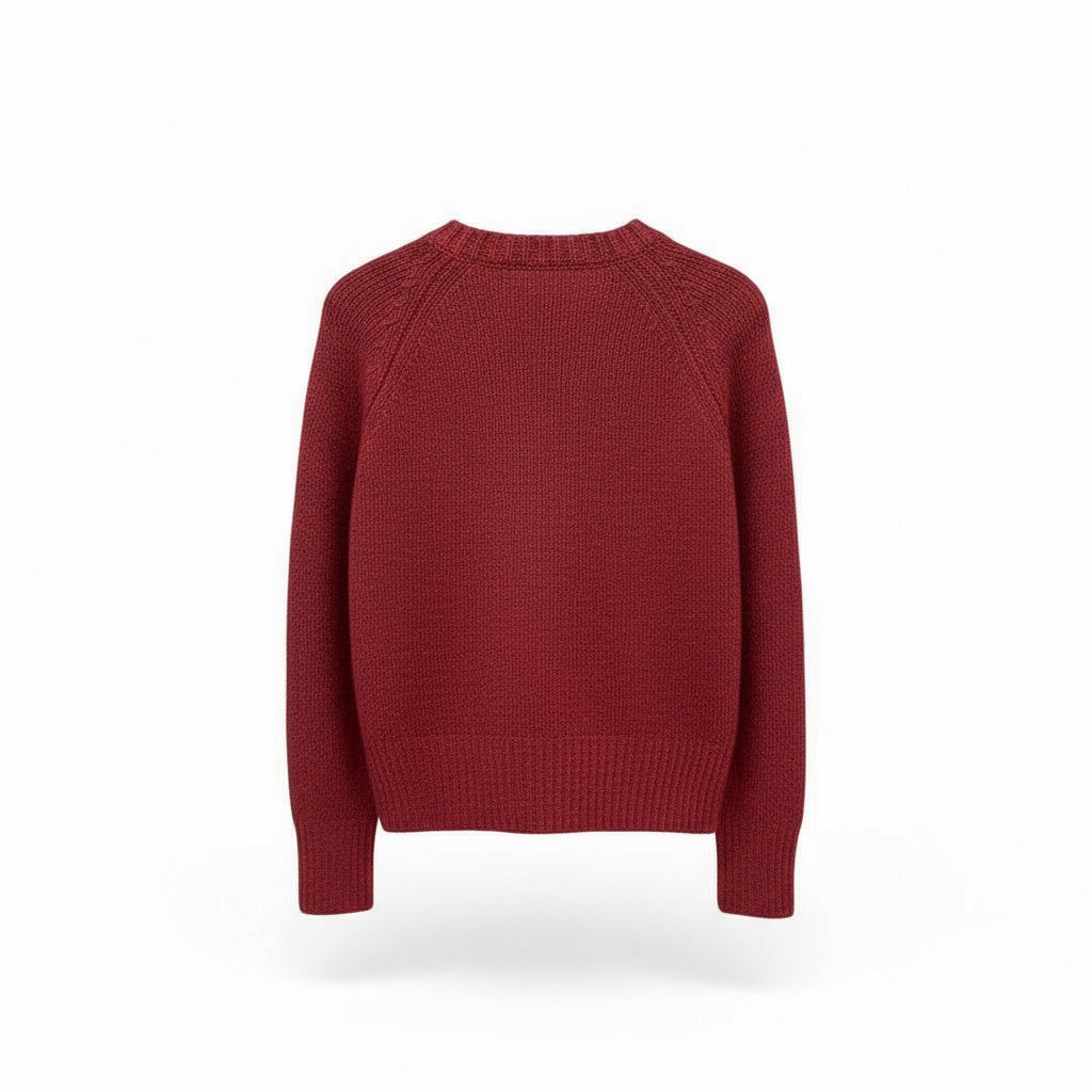 Back of a red sweater on a white background.