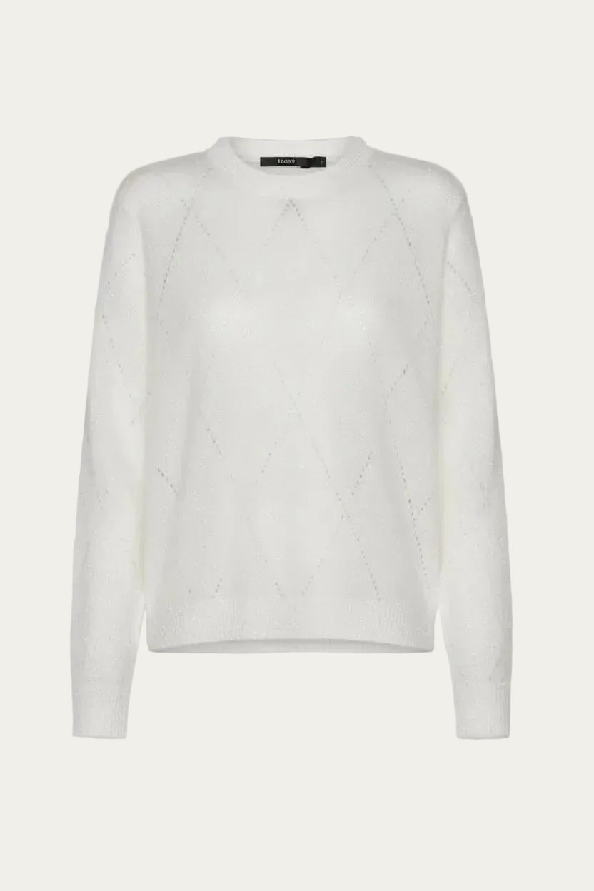 White sweater with diamond detailing.