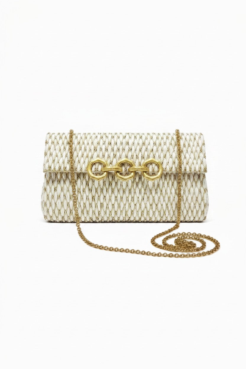 Woven handbag with gold chain strap on a white background.