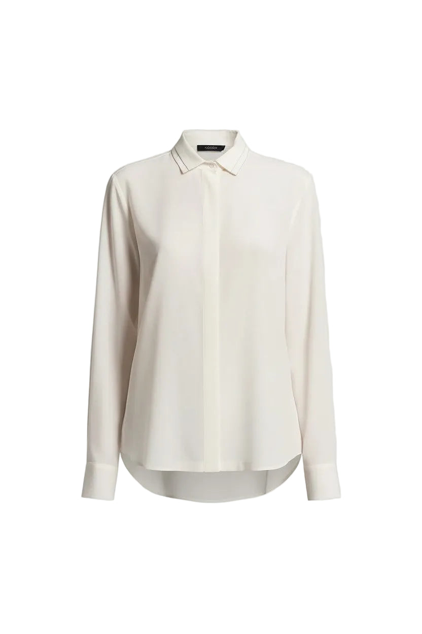 White blouse with sparkle detailing on a white background.